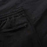 pantaloni con coulisse in seersucker con dettaglio tasca posteriore in colore blu