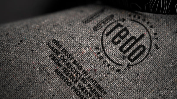 Detail of the recycled material shopping bag for MONOBI garments