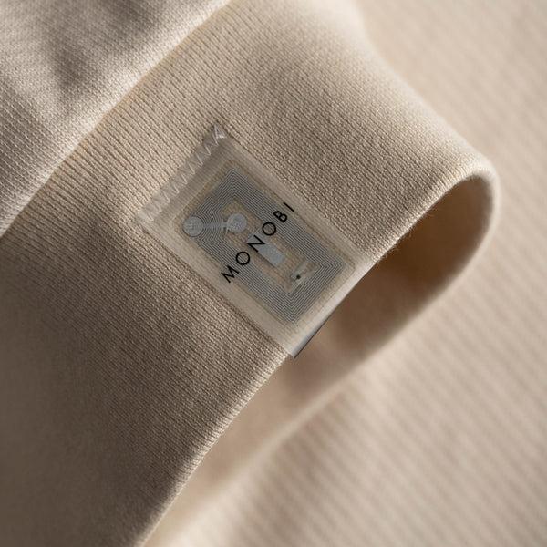 Detail of the border and NFC TAG of the MONOBI sweatshirt