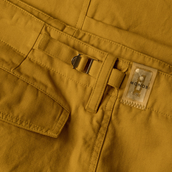 Detail of the loop, buckle and NFC TAG on the ochre cargo pants