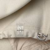 Drawstring and NFC tag details of RESPONSIBLE WOOL COACH JACKET / NATURALE