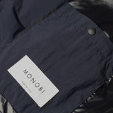 MONOBI label and button detail of ECO POP VEST / BLUE NAVY