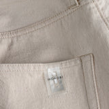 poacket and NFC tag details of RAW INDIGO SELVAGE DENIM / NATURALE pants