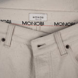 closure detail of RAW INDIGO SELVAGE DENIM / NATURALE pants