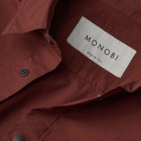 collar and MONOBI label details of DYEPOP SHIRT / RUGGINE
