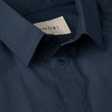 collar and MONOBI label detail of DYEPOP SHIRT / PETROLIO