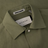collar and MONOBI label details of ORIGAMI OUTERSHIRT / VERDE SALVIA