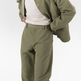 model wears ORIGAMI PANTS / VERDE SALVIA