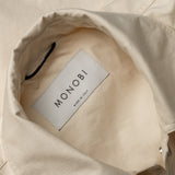 collar and MONOBI label details of BIO GABARDINE COACH JACKET / NATURALE
