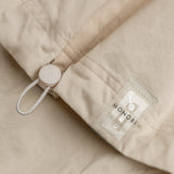 drawstring and NFC tag details of BIO GABARDINE COACH JACKET / NATURALE