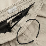 drawstring detail of AGELESS CORDUROY PANTS / GESSO