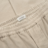 MONOBI label detail of AGELESS CORDUROY PANTS / GESSO