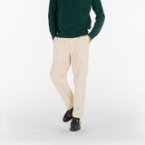 model wears AGELESS CORDUROY PANTS / NATURALE