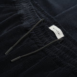 drawstring and label details of AGELESS CORDUROY PANTS / BLUE NAVY