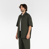 3/4 position of the seersucker short sleeved shirt in deep green colour