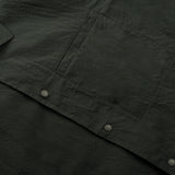 buttons and front pocket details of the seersucker short sleeved shirt in deep green colour