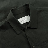 collar and label details of the seersucker short sleeved shirt in deep green colour