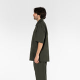 side position of the seersucker short sleeved shirt in deep green colour