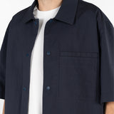 model is wearing seersucker short sleeved shirt in blue colour