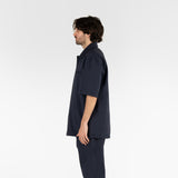 side position of the seersucker short sleeved shirt in blue colour