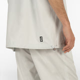 model is wearing seersucker drawstring pants and seersucker short sleeved shirt in grey colour