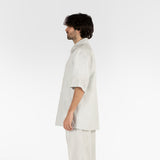 side position of the seersucker short sleeved shirt in grey colour