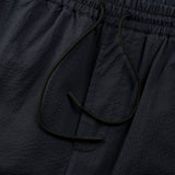 drawstring detail of the seersucker shorts in blue colour