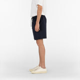 side position of the seersucker drawstring shorts in blue colour