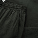 side pocket detail of the seersucker drawstring pants in deep green colour