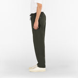 side position of the drawstring seersucker pants in deep green colour