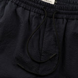 drawstring detail of the seersucker pants in blue colour