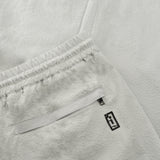 back pocket detail of seersucker drawstring pants in grey colour