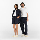 two models are wearing all the garments of the Seersucker Capsule Collection in blue colour
