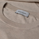 Dettaglio etichetta MONOBI su maglione COTTON CASHMERE WHOLEGARMENT 18G / BEIGE MELANGE