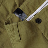 Dettaglio bottoni dei pantaloni HERRINGBONE CARGO / VERDE RANA