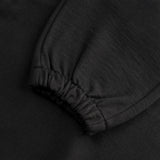 Dettaglio polsino elastico dei joggers loungewear in lana Superior colore nero