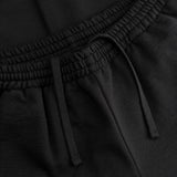 Dettaglio polsino elastico dei joggers loungewear in lana Superior colore nero