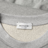 MONOBI label detail of FULL ORGANIC SWEATSHIRT / PIETRA MELANGE