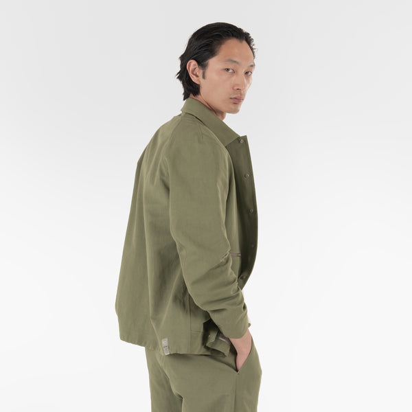 the model wears the origami outershirt / verde salvia jacket