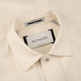 collar and MONOBI label details of ORIGAMI OUTERSHIRT / NATURALE jacket