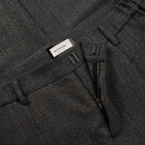 magnetic closure and zip details of ORIGAMI WOOL PANTS / SPIGATO