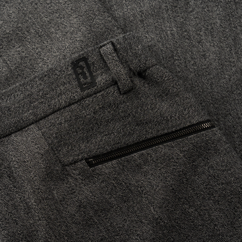 back pocket zip and NFC tag details of ORIGAMI WOOL PANTS / SPIGATO