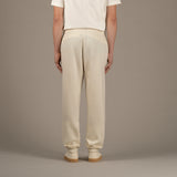 Model wears superior wool loungewear joggers color naturale, back