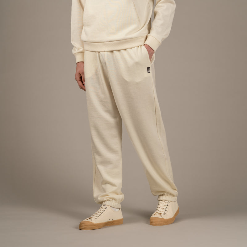 Model wears superior wool loungewear joggers color naturale