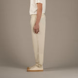 Model wears superior wool loungewear joggers color naturale, side