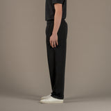 Model wears superior wool loungewear joggers color black, side